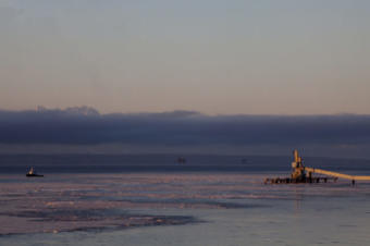 Cook Inlet oil platforms are visible from shore near Kenai, Alaska. (Photo by Rashah McChesney/Alaska’s Energy Desk)