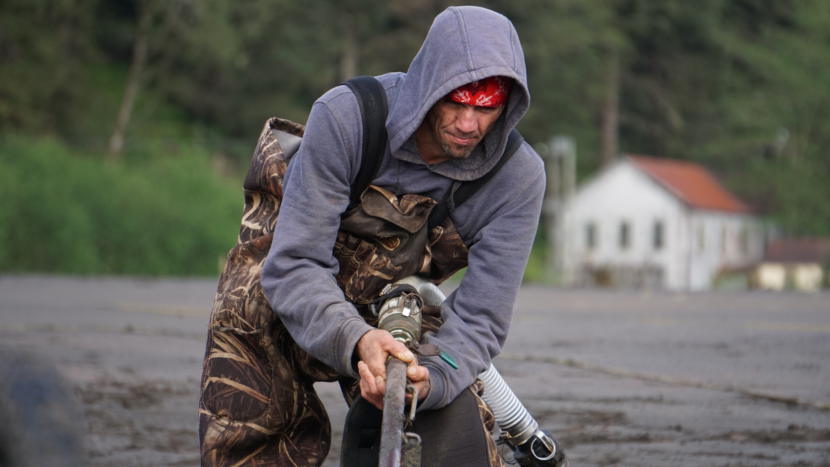 Nathan Brooks sprays seawater into sand on the beach near Sheep Creek in Juneau on May 15, 2019. It's part of his recreational gold dredging operation.