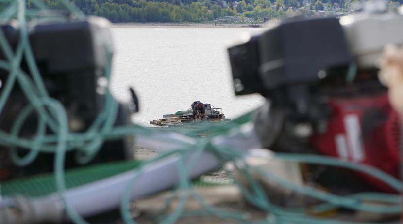 Nathan Brooks tidies up his raft at the beach near Sheep Creek in Juneau on May 15, 2019. He and other recreational gold dredgers leave their gear out there.