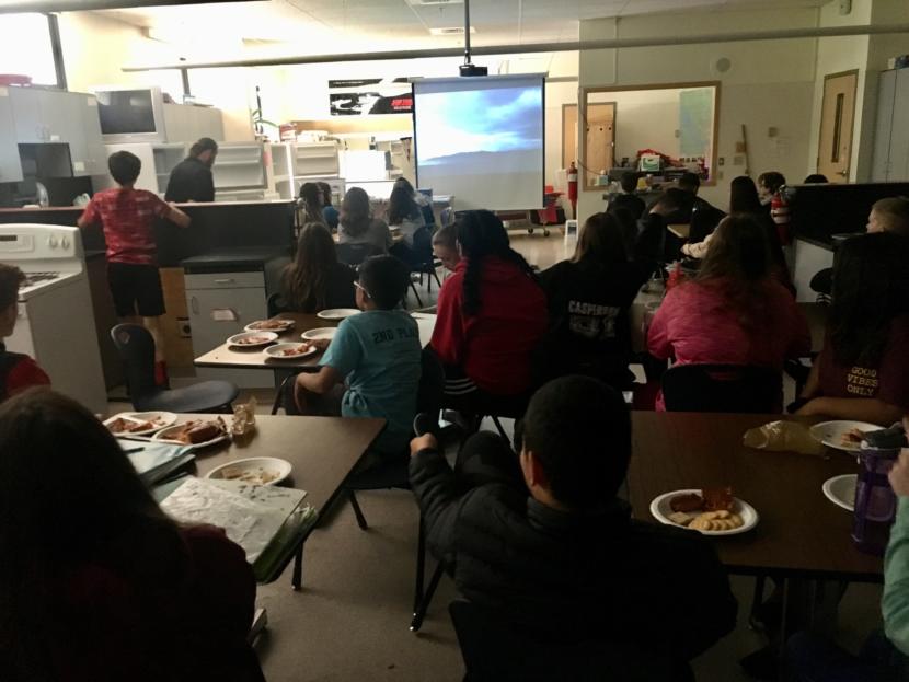 Students in Chris Heidemann's outdoor life skills class on May 20, 2019, enjoying the salmon they smoked the week before. (Photo by Zoe Grueskin/KTOO)