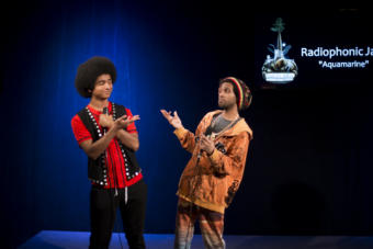 Arias Hoyle and Chris Talley pose after their Red Carpet Concert during the 2019 Alaska Folk Festival. (Photo by Annie Bartholomew/KTOO)