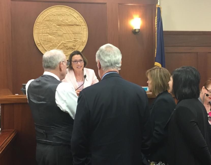 Senate President Cathy Giessel, R-Anchorage, talks with four senators about a bill that would set the permanent fund dividend amount for this year in the Capitol in Juneau, June 4, 2019. (Photo by Andrew Kitchenman/KTOO and Alaska Public Media)