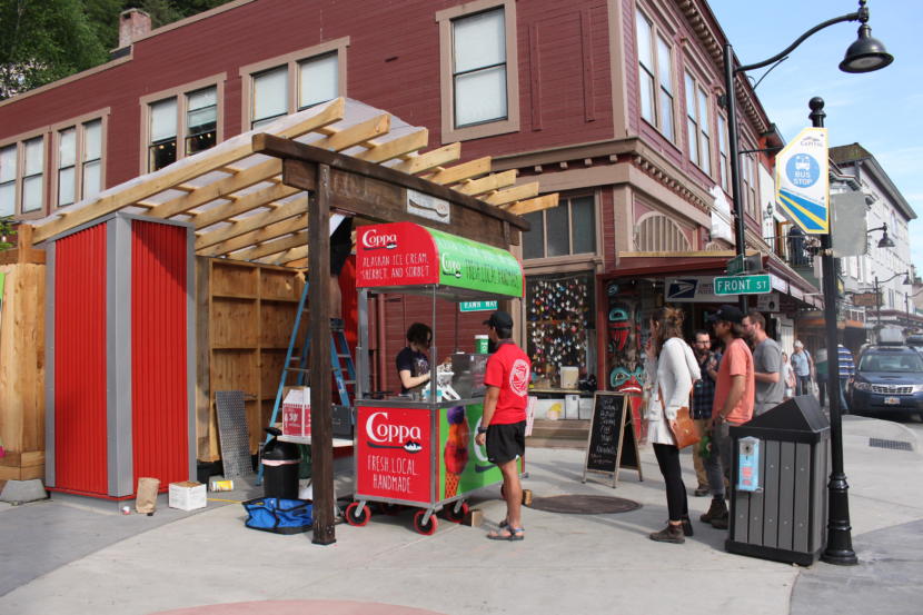 Marc Wheeler, the owner of Coppa, is enthusiastic about ice cream and wood. He has a couple of pieces constructed from old growth trees at his brick and mortar store. But he's not in favor of large scale industrial logging. He opted to use young growth wood at his latest location. (Photo by Elizabeth Jenkins/Alaska's Energy Desk)