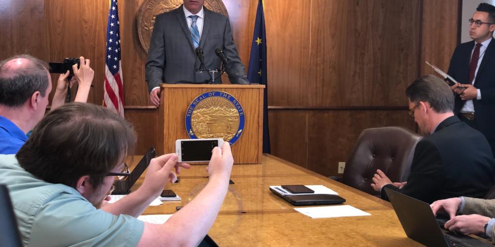 Alaska Gov. Mike Dunleavy speaks to reporters during a press conference at the Capitol, June 28, 2019.