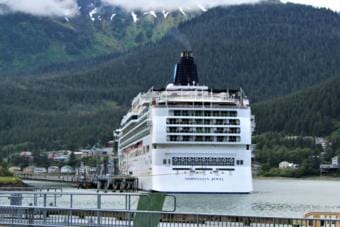 The Norwegian Jewel sits at port in Juneau with a faint plume of exhaust visible above it on June 13, 2019. (Photo by Adelyn Baxter/KTOO)