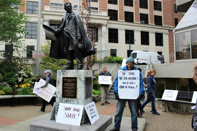 Retired Alaska Marine Highway System employee Tony Tengs joins other former and current state employees at a rally outside the Alaska State Capitol on June 12, 2019. (Photo by Adelyn Baxter/KTOO)