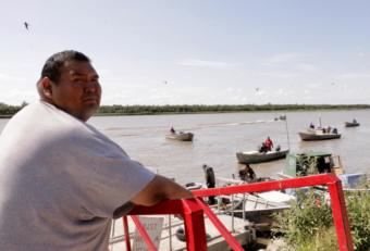 Commerical fisherman and Kwik'Pak store clerk Kenneth Lee gassing up boats in Emmonak, Alaska on July 15, 2019. (Photo by Anna Rose MacArthur/KYUK)