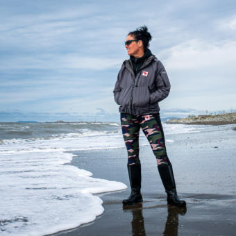 Freya Hoffmeister looking out at the Bering Sea from the shore near Nome.