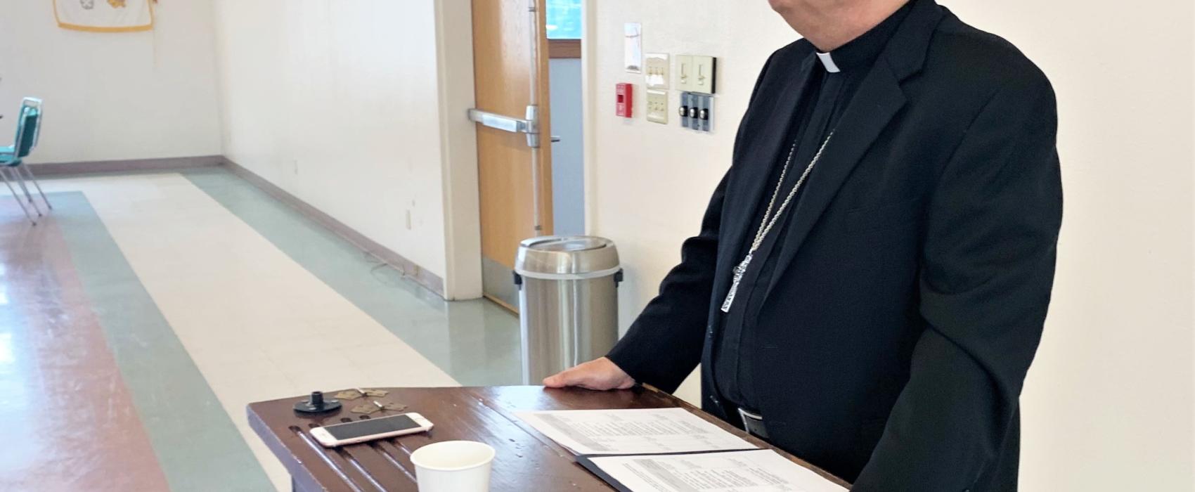 Bishop Andrew Bellisario addresses reporters at St. Ann's Parish Hall on August 21, 2019. (Photo by Adelyn Baxter/KTOO)