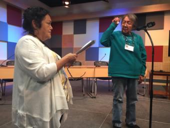 Gus'dutéen Bessie Jim (right) indicates a high tone on a letter at the 4th International Lingít Spelling Bee held in Juneau on Sep. 27, 2019. Virginia Oliver (left) gave the words and served as judge. (Photo by Zoe Grueskin/KTOO)