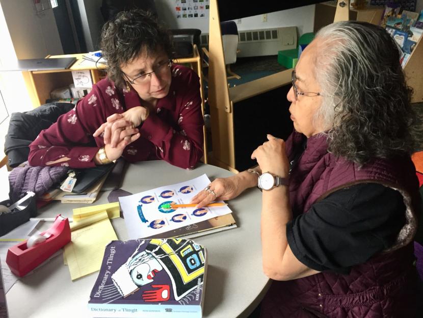 Daaljíni Mary Cruise (left) works on a lesson plan with Kaakal.aat Florence Marks Sheakley in the Haa Yóo X̱ʼatángi Kúdi Lingít immersion classroom in Juneau on Oct. 9, 2019. (Photo by Zoe Grueskin/KTOO)