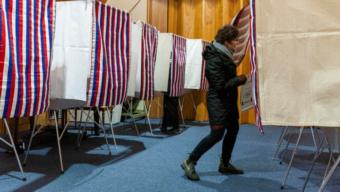A voter enters an election both at Northern Light United Church during Municipal Elections on October 1, 2019, in Juneau, Alaska. (Photo by Rashah McChesney/KTOO)
