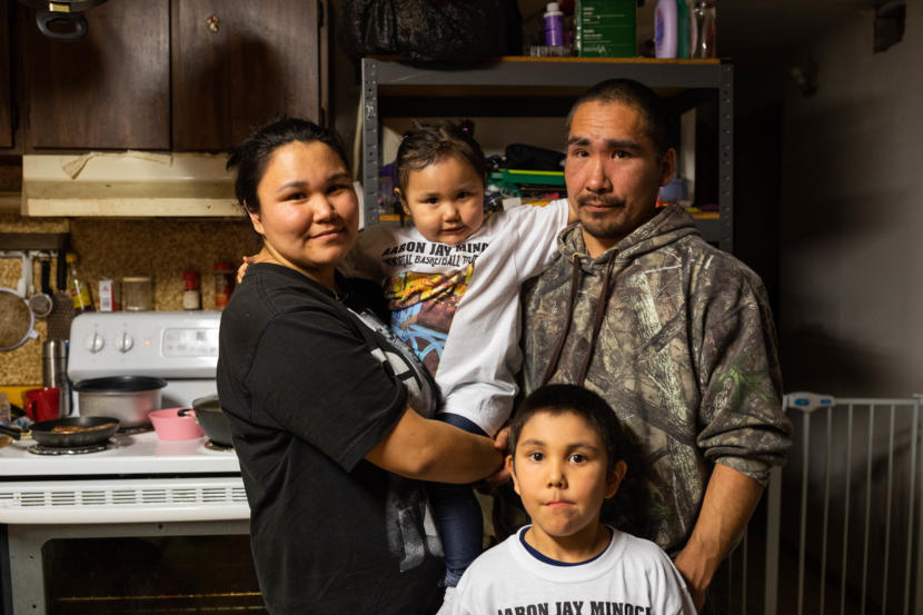 Cassandra and Nicephore Askoak and their children, Amelia, 2, and Blake, 5, in their home on March 9, 2019 in Russian Mission. Nicephore's father Simeon Askoak was a Village Public Safety Officer in Russian Mission when he committed suicide in the spring of 2005. (Photo by Loren Holmes/Anchorage Daily News)