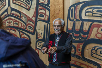 Sealaska Heritage Institute cultural interpreter John Lawrence talks to visitors at the institute's Walter Soboleff Building in downtown Juneau, Sept. 5, 2019. (Photo by Rashah McChesney/KTOO)