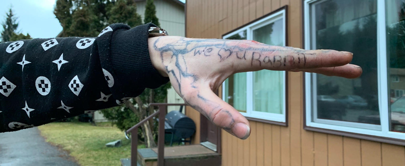 Residents and visitors at the Chinook apartment complex in the Mendenhall Valley show tattoos they were given by Kelly "Rabbit" Stephens on Sunday, Dec. 29, 2019 in Juneau, Alaska. Stephens was killed during an eaerly-morning altercation with Juneau Police. (Photo by Rashah McChesney/KTOO)