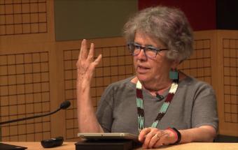 Susan Fitzgerald, a former Juneau resident and current volunteer at a refugee shelter in Las Cruces, New Mexico, speaks to the Juneau World Affairs Council at KTOO in Juneau on May 31, 20, 2019. She's fed and worked with hundreds of refugees through her volunteer experience.