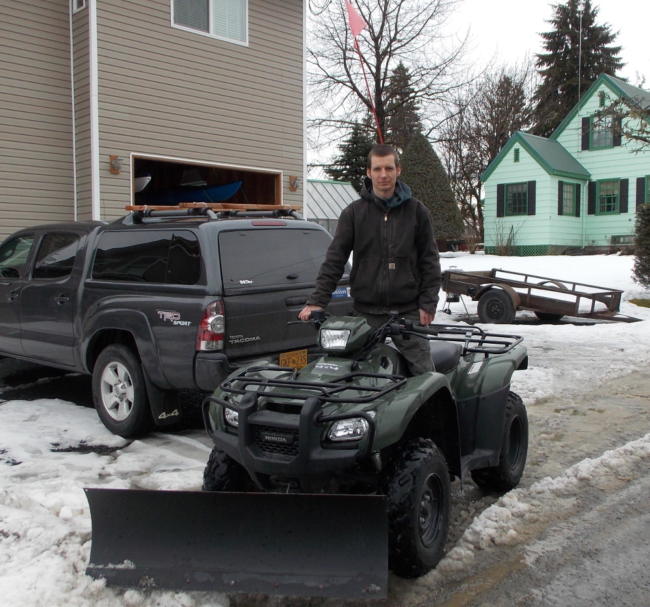 Richard Burke plows outside his home in 2017. (Joe Viechnicki/KFSK)