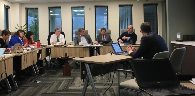 Alaska Permanent Fund Corporation trustees and executives discuss the future of the fund's earnings reserve account at a board meeting on Feb. 20 at the corporation's headquarters in Juneau. Seated, from left: chief executive Angela Rodell; trustees Corri Feige, Mary Rutherford, Craig Richards and William Moran; investment adviser Timothy Walsh; and Chief Investment Officer Marcus Frampton. Photo by Andrew Kitchenman/KTOO and Alaska Public Media