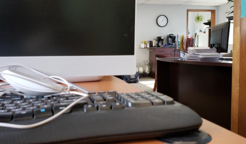 A half-packed workstation idles at an unusually quiet office of Juneau Tours and Whale Watch on March 13, 2020. The suspended cruise ship season means instead of hiring up, the business is laying off year-round staff and moving to a smaller office.