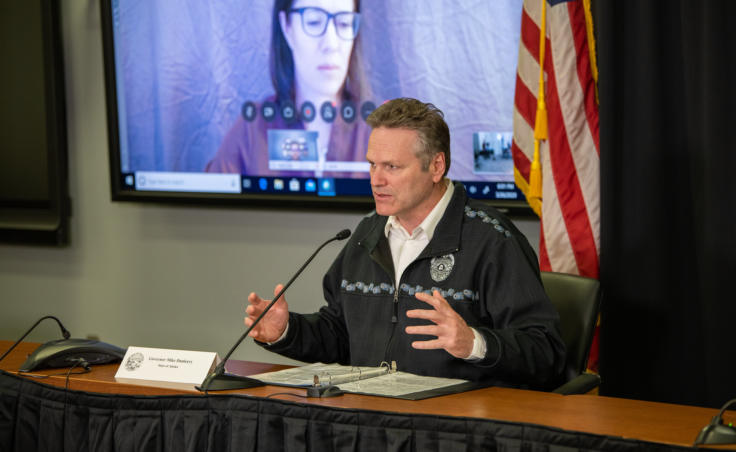 Alaska Gov. Mike Dunleavy speaks at a news conference on COVID-19 in Anchorage, Thursday, March 26, 2020. Chief Medical Officer Dr. Anne Zink spoke remotely and appeared on a TV screen to the governor's right. (Creative Commons photo courtesy Alaska Governor's Office)