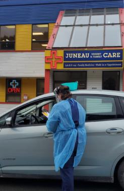 Sky Womack, of Juneau Urgent & Family Care, administers a drive-up test for coronavirus on Thursday, March 19, 2020 in Juneau, Alaska. (Photo courtesy Alicia McGuire)