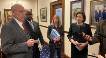 Members of Alaska Senate Majority hold a press conference about funding for COVID-19 preparedness outside Senate Chambers in Juneau on March 11, 2020.