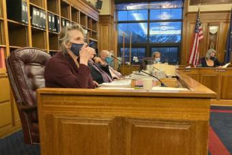 Palmer Republican Rep. DeLena Johnson pauses before commenting on her budget amendment to pay $3,000 dividends on Thursday in the Alaska State Capitol in Juneau, Alaska. Rep. Adam Wool, D-Fairbanks; Rep. Andy Josephson, D-Anchorage; a committee aide; Rep. Sara Rasmussen, R-Anchorage; and Rep. Kelly Merrick, R-Eagle River, are behind Johnson. (Photo by Andrew Kitchenman/KTOO and Alaska Public Media)