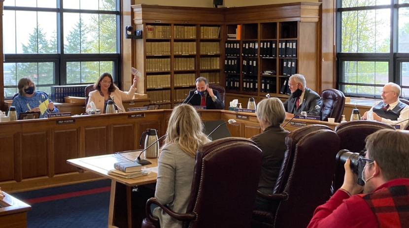Eagle River Republican Sen. Lora Reinbold waves her mask immediately after taking it off on May 14, 2021, in the Alaska State Capitol in Juneau. (photo by Andrew Kitchenman/KTOO and Alaska Public Media)
