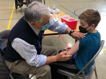 12-year-old Garrett McGuan gets his first dose of the COVID1-9 vaccine at Dzantik'i Heeni Middle School on Monday, May 17.