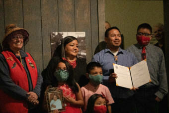 Martin Stepetin stands with his family holding House Bill 10. Alaska Gov. Mike Dunleavey signed the bill on June 8 at the Juneau-Douglas City Museum