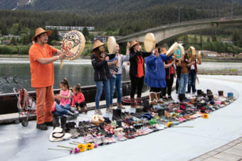 Drummers sing songs to honor the children found buried at a residential school in Kamloops, British Columbia. (Photo by Lyndsey Brollini/KTOO)