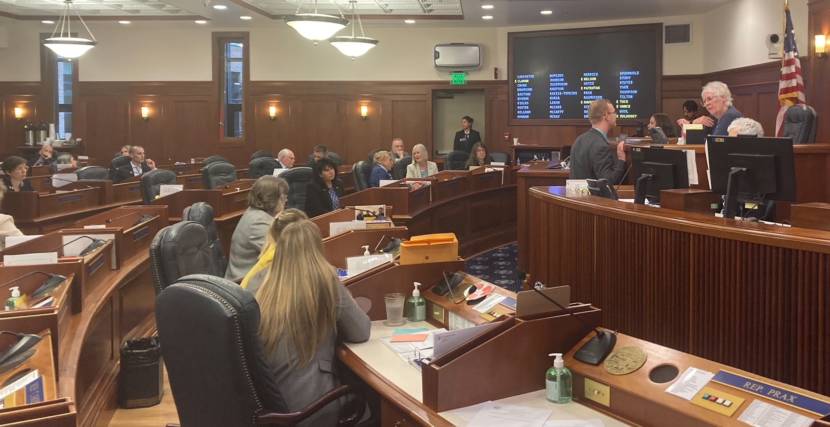 Alaska House of Representative members attend the first floor session of the second special session this year on June 23, 2021, in the Alaska State Capitol in Juneau. House Speaker Louise Stutes, R-Kodiak, on the far right, talks with Rep. David Eastman, R-Wasilla, about comments he was making on the floor. (Photo by Andrew Kitchenman/KTOO and Alaska Public Media)