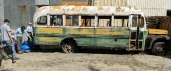 UA Museum of the North Director Pat Druckenmiller checks out Bus 142 last week with Colin Howard, left, and Aaron Warkinton, right, who work for Pennsylvania-based B.R. Howard Conservation. (Photo by Tim Ellis/KUAC)