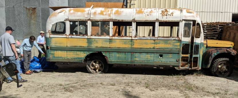 UA Museum of the North Director Pat Druckenmiller checks out Bus 142 last week with Colin Howard, left, and Aaron Warkinton, right, who work for Pennsylvania-based B.R. Howard Conservation. (Photo by Tim Ellis/KUAC)
