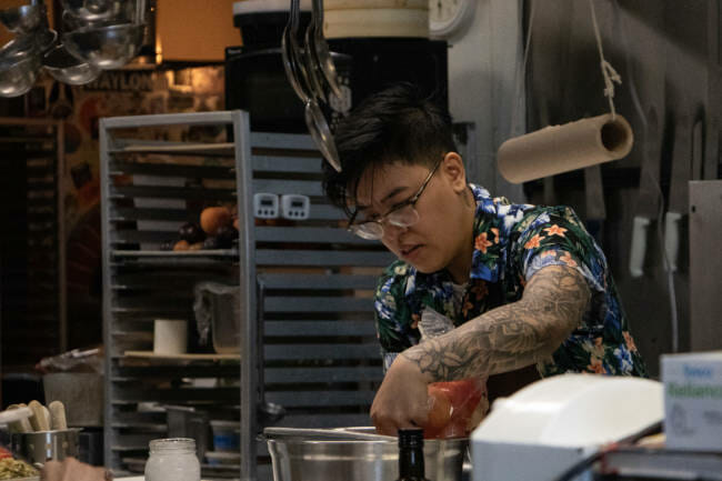 Rachel Barril works in the kitchen of Juneau Italian restaurant In Bocca Al Lupo for their event "Dinner with Friends: Womxn of Power edition" on June 26. (Photo by Lyndsey Brollini/KTOO)