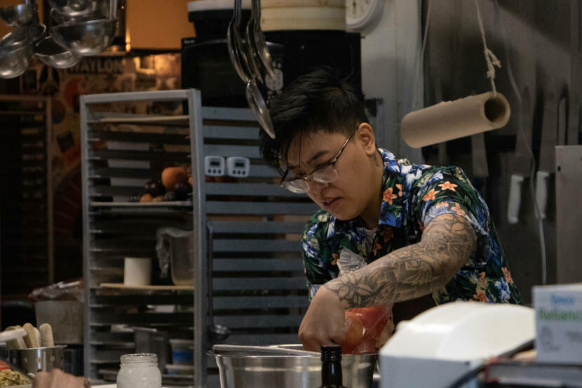 Rachel Barril works in the kitchen of Juneau Italian restaurant In Bocca Al Lupo for their event "Dinner with Friends: Womxn of Power edition" on June 26. (Photo by Lyndsey Brollini/KTOO)