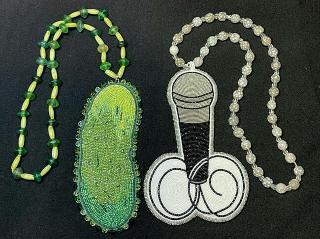 Two beaded medallions, a pickle and a microphone, made by Kaasteen Jill Meserve for the show Reservation Dogs. (Photo courtesy of Jill Meserve)