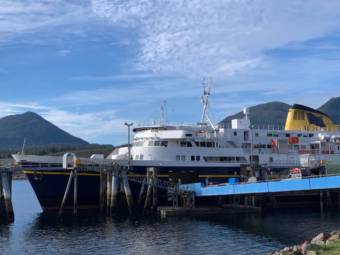 Vehicles driving onto a docked ferry