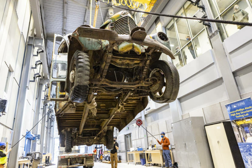 view of the underside of the McCandless bus as it's lowered into place indoors