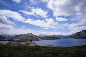 A view of the single-runway Unalaska airport with Dutch Harbor behind it.