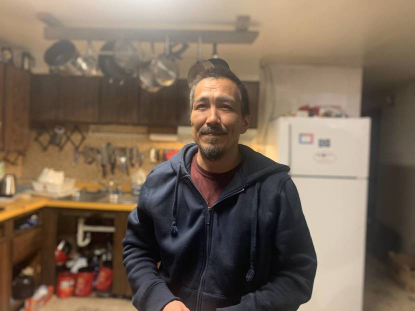 A man standing in a kitchen