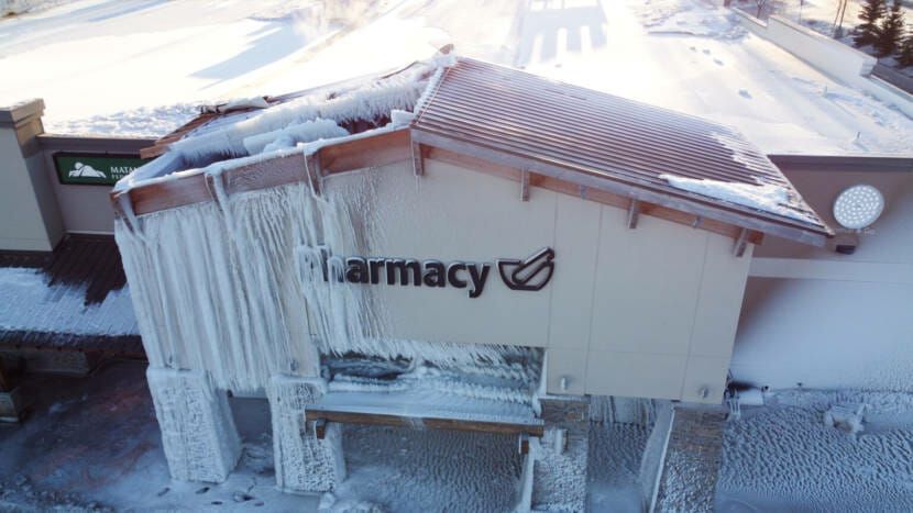 Thick columns of ice on the front of a supermarket