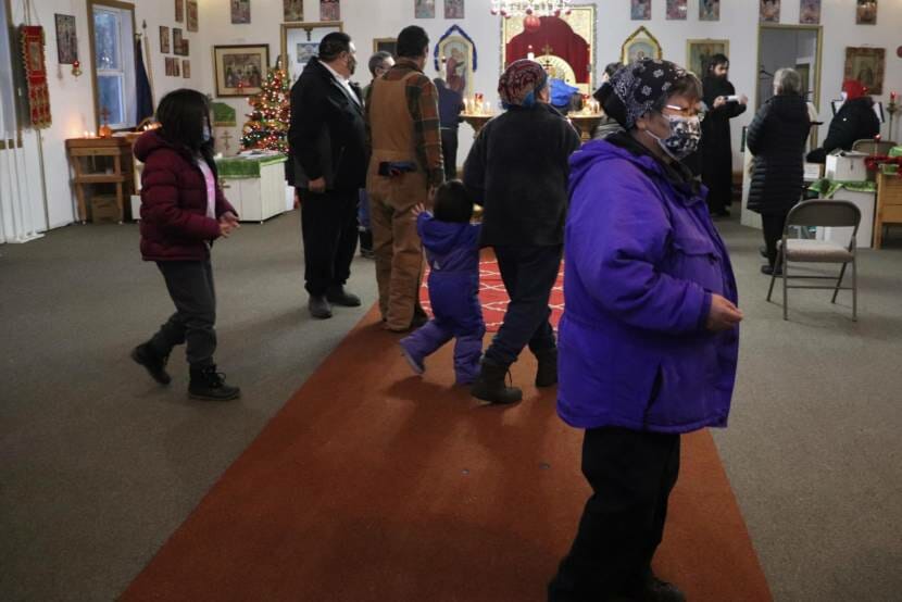 A group of people standing inside a church