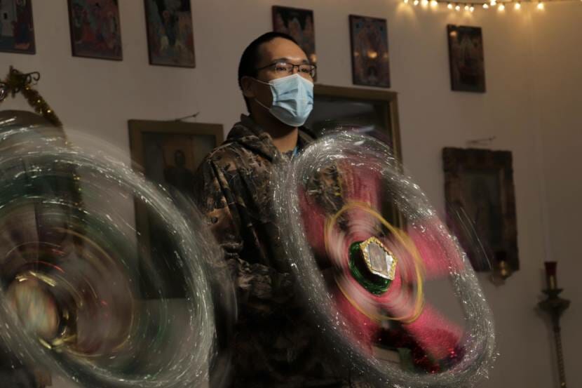 A man spinning a tinsel star