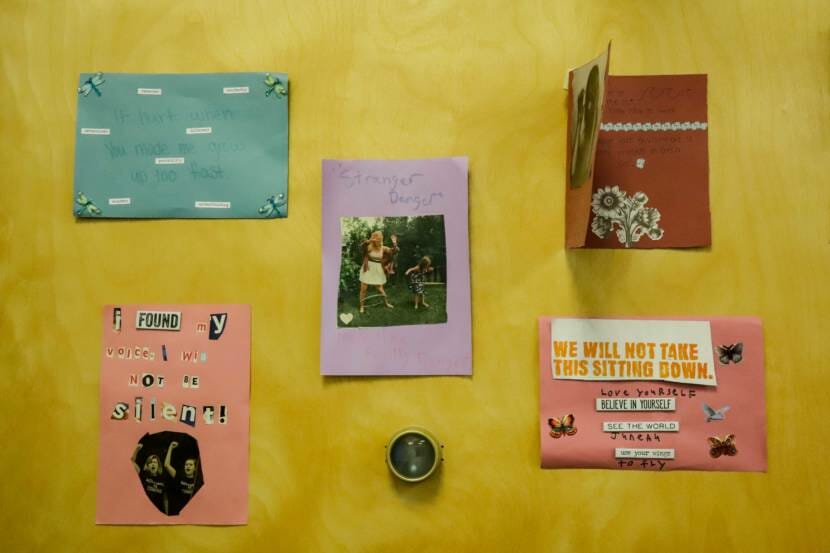 collage art taped to a wall