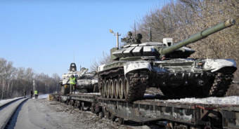 Tanks on flatbed cars on a train
