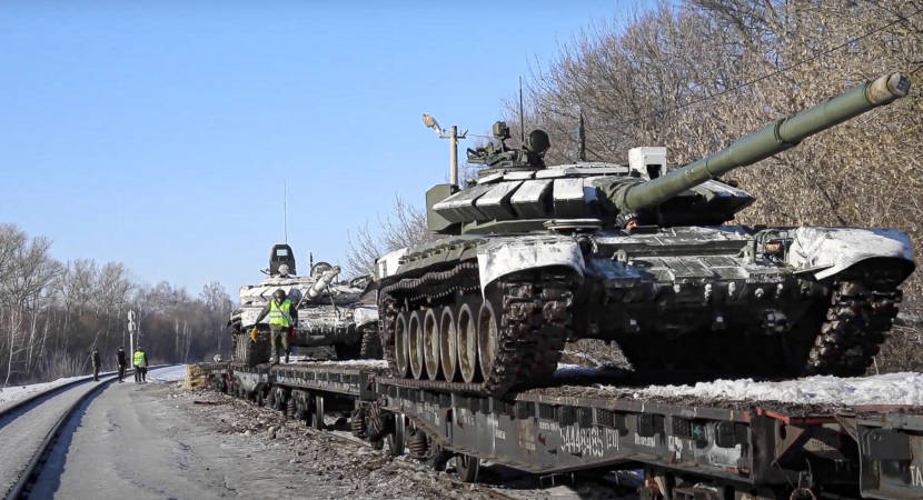 Tanks on flatbed cars on a train