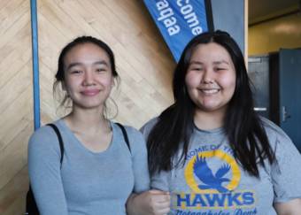 Two young women smiling and posing for a photo