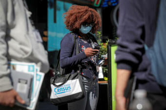 A Census Bureau worker on a city street