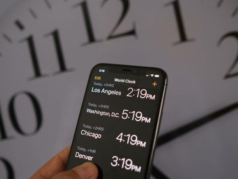 A hand holding a smartphone